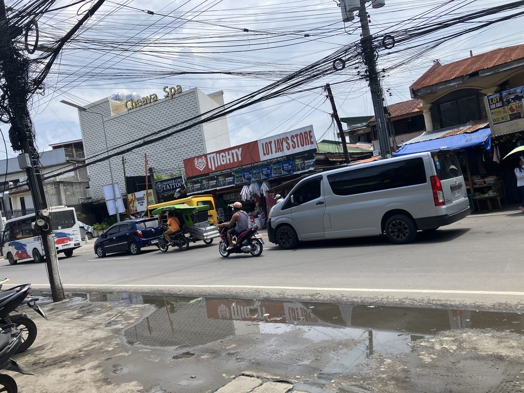 Bumpy road with puddles in Cebu